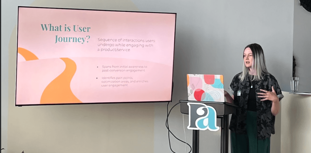 Lindsey Hart presenting on what user journey is at Perfect Afternoon's Embracing the Journey workshop in Pleasant Ridge, Michigan.